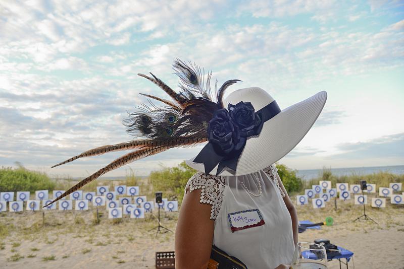 Holly Scaro shows off her elaborate handmade hat of peacock plumes and pheasant feathers.